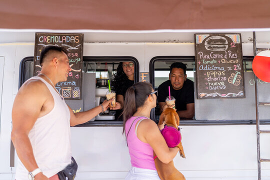 Couple enjoying a frappe in a food truck