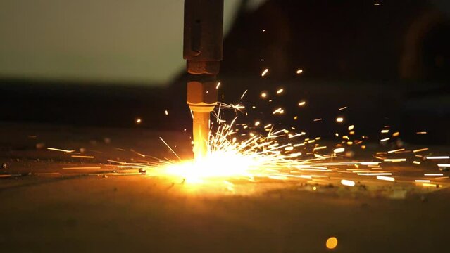 Metal transformed: Watch a blaster machine cut sheet metal with laser precision in this vivid stock footage, a showcase of modern industrial efficiency.
