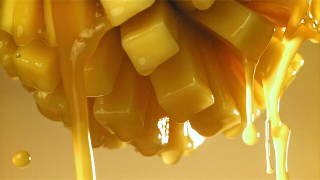 The juice flows through the sliced mango fruit. Filmed on a high-speed camera at 1000 fps. High quality FullHD footage