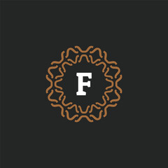 Initial letter F ornamental border circle frame logo