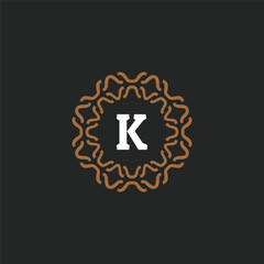 Initial letter K ornamental border circle frame logo