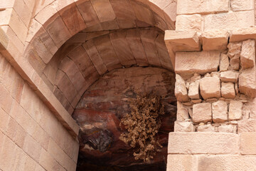 The arched entrance made of large stones to main fasade of the Great Temple in the Nabatean Kingdom...