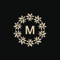 Initial letter M ornamental border circle frame logo
