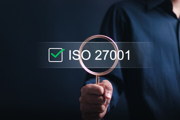 ISO 27001 concept. Businessman choose ISO 27001 for information security management system (ISMS)....