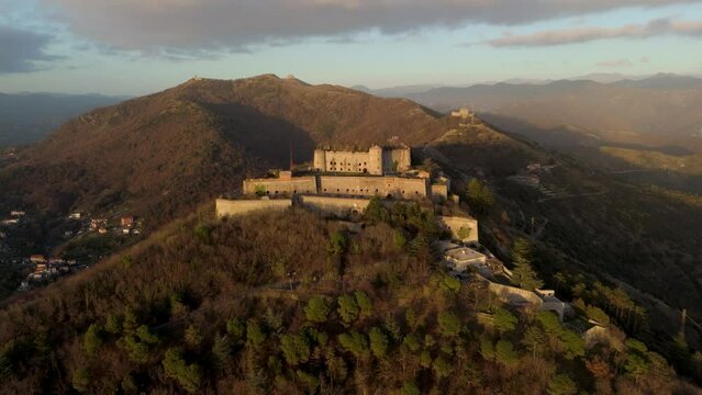 Forte Sperone on a hilltop at sunset, overlooking Genoa, aerial view