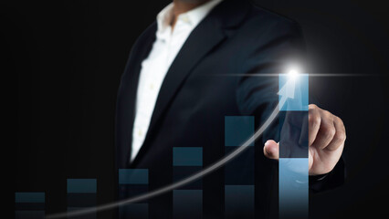 Business development to success motivation concept. Businessman is pointing arrow graph corporate future growth plan.