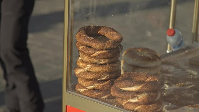 Istanbul bagel simit seller and his bagels on the counter