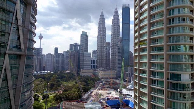 KL City petronas twin towers Skyscraper day. Dramatic aerial view flight drone