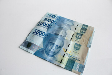 Cash payment concept. Indonesian rupiah currency (Rp. 50.000 Seratus Ribu Rupiah), fifty thousand Indonesian rupiah money.