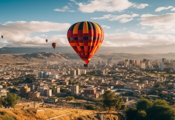 Group of Hot Air Balloons Soar Above City