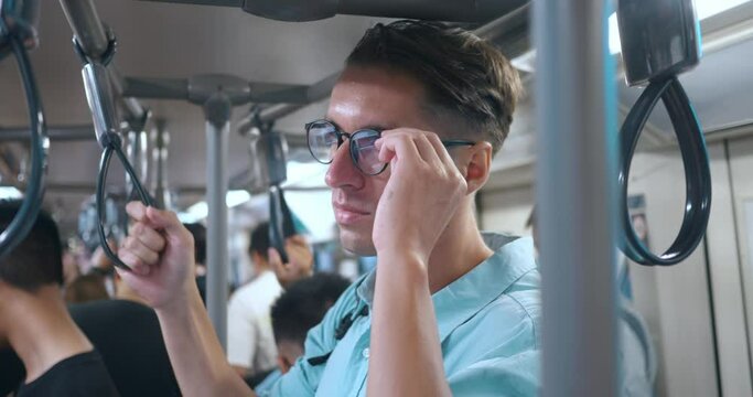Man backpack subway, subtly adjusting his glasses, serves metaphor connection, highlighting seamless integration interconnectedness urban transport. integral role connection daily commuting.