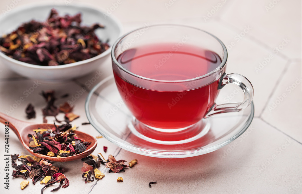 Sticker Glass cup of hot hibiscus tea.