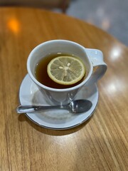 A glass of hot lemon tea for rainy season
