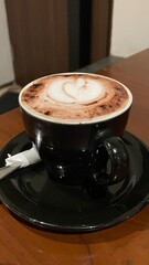 A cup of delicious hot chocolate on the wooden table