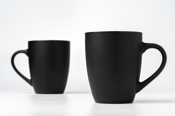 Black coffee mugs mock up on white background copy space
