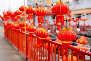 Red Chinese lanterns lined up along the footbridge In the capital on Chinese New Year, waiting to...
