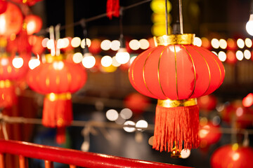 An image of several red Chinese lanterns in the right corner and a bokeh background in celebration...