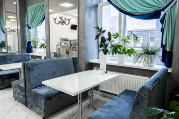 Interior of light colored canteen at the business center