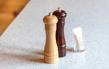 Salt and pepper on the table in a cafe. Close-up