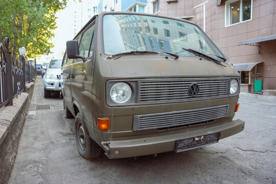 Almaty, Kazakhstan - August 17, 2023: The front part of the Volkswagen Transporter car is green