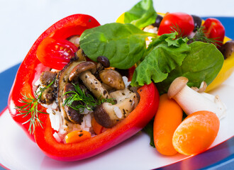 Bell peppers stuffed with mushrooms, rice, vegetables and herbs