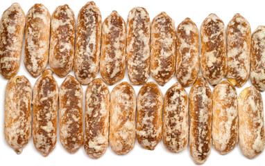 Lots of traditional glazed gingerbread. Gingerbread texture. Gingerbread on a white background, top...