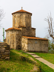 Spring landscape with ancient Orthodox Church of Archangel built of rubble on territory of Nekresi...
