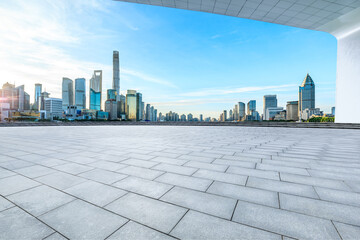Empty square floor and city skyline with modern buildings scenery at sunrise in Shanghai