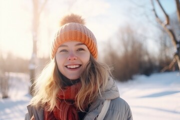 Fototapeta na wymiar Winter portrait of a girl in pompom hat