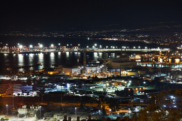 Fototapeta na wymiar Dazzling night view of Haifa's port and gorgeous Mediterranean sea in Israel