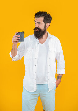 image of man has coffee break isolated on yellow background