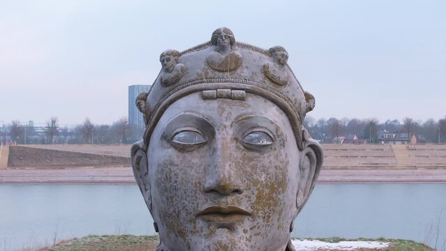 Dolly retreat drone shot of the Mask "Gezicht van Nijmegen" (roman helmet mask Nijmegen)
