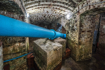 A water pipe in an old basement.