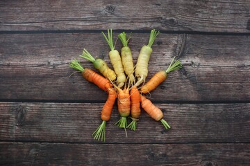 bunch of carrots on wooden table