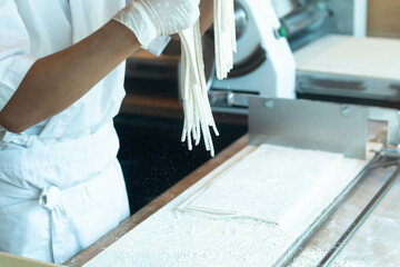 Chef making raw udon japanese noodle