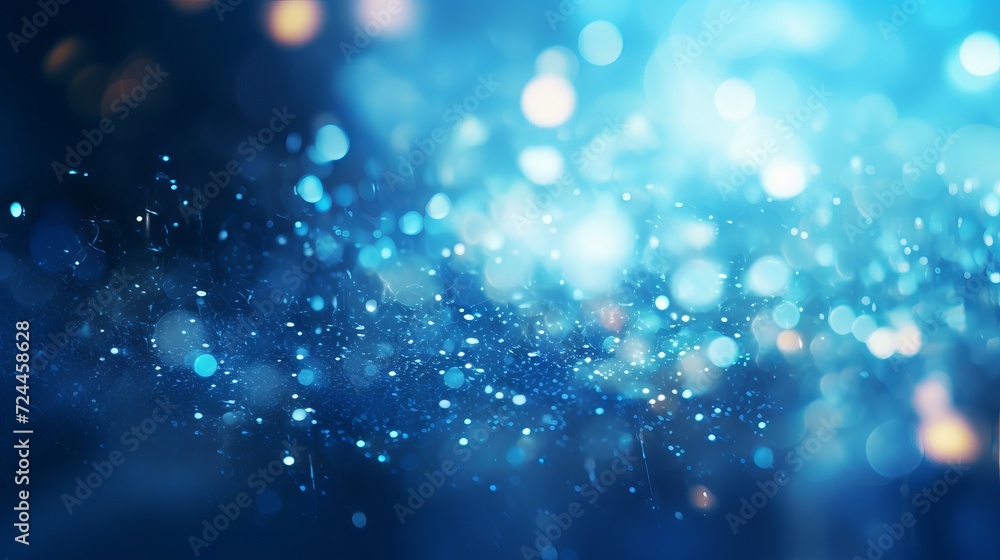 Poster blue glowing particles on dark background with bokeh effect