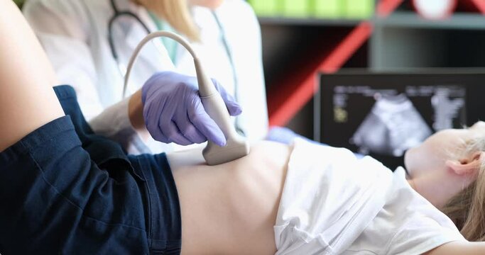 Medical examination of little girl using ultrasound equipment. Medical examination of the internal organs of child concept