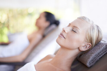 Spa, woman and wellness on massage bed with relax for skincare, zen and beauty treatment for body...