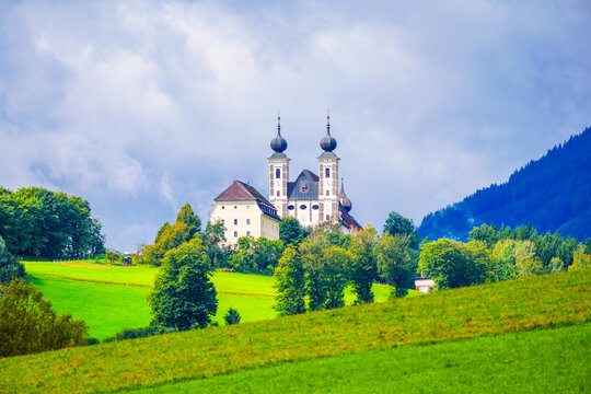 View of the Frauenberg pilgrimage church on the Enns and the surrounding landscape. Historic Christian church in the Ennstal in the town of Frauenberg.
