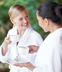 Spa, friends and happy women drinking coffee for health, wellness and skincare treatment. Girls, tea cup and salon for beauty, luxury body therapy in bathrobe and diverse people relax together - obrazy, fototapety, plakaty