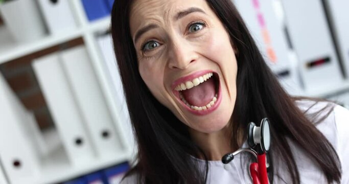 Woman doctor afraiding and screaming in clinic 4k movie slow motion. Psychological assistance to medical staff concept
