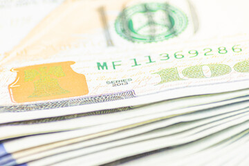 Lots of 100 dollar bills, macro, close-up money. the concept of US cash money. US paper money. Bribery with a wad of money, cash circulation and money exchange currency. Background of 100 dollar bills