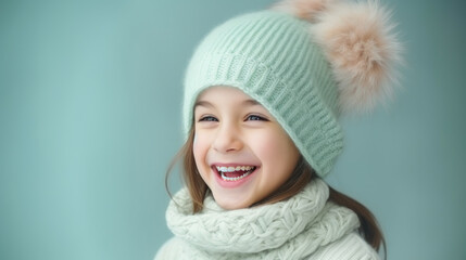 Little girl in knitted hat and scarf