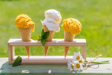 Foto op Plexiglas Refreshing ice cream in waffle cones with lemon flavour © karandaev