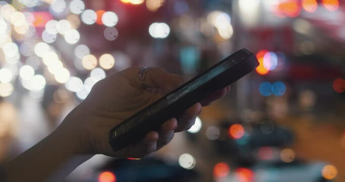 Hand holding phone helps move around city traffic background close-up Navigation key in modern city. Navigation simplifying road traffic movement Navigation ally in city that never sleeps.