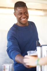 Smile, party and a black man bartender serving drinks outdoor at an event, festival or celebration....