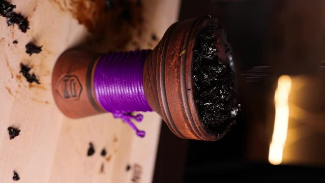 tobacco is poured into a bowl cooking a hookah vertical video