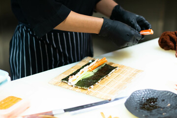 Sushi of japanese, Chef hands preparing japanese food, japanese chef making sushi at restaurant