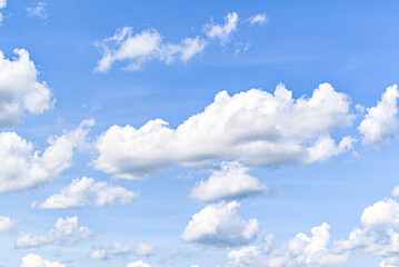 White clouds in a bright blue sky. The beauty of the nature