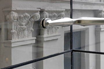 Glass wall and chrome  handle. Auckland art gallery. Museum for modern art.  Auckland New Zealand